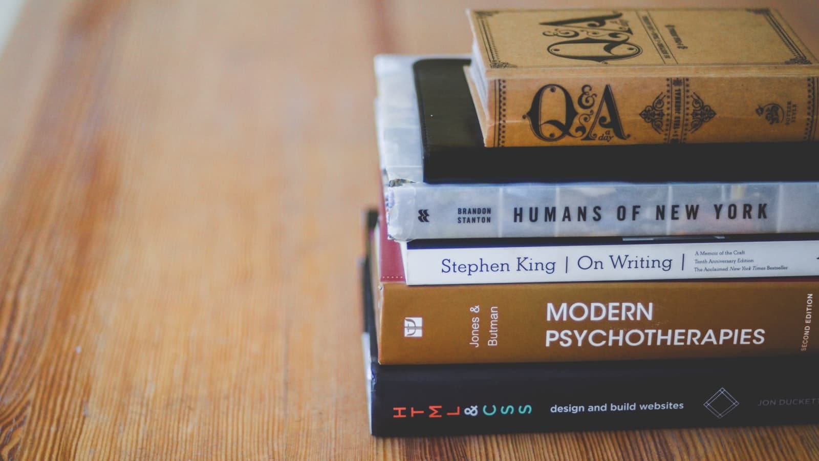 Assorted reading books on table